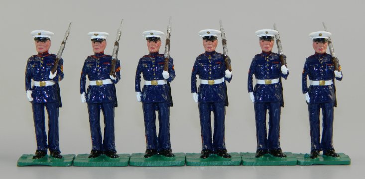 US Marines in Dress Blues at Left Shoulder Arms